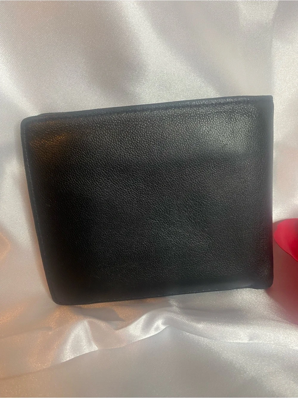 Classic Black Leather Bi-Fold Wallet with Subtle Embossed Logo